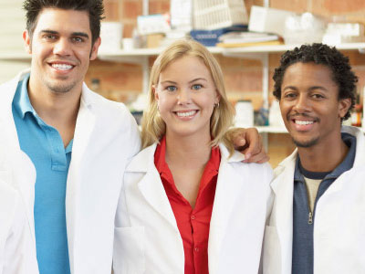 Photo of students in lab coats