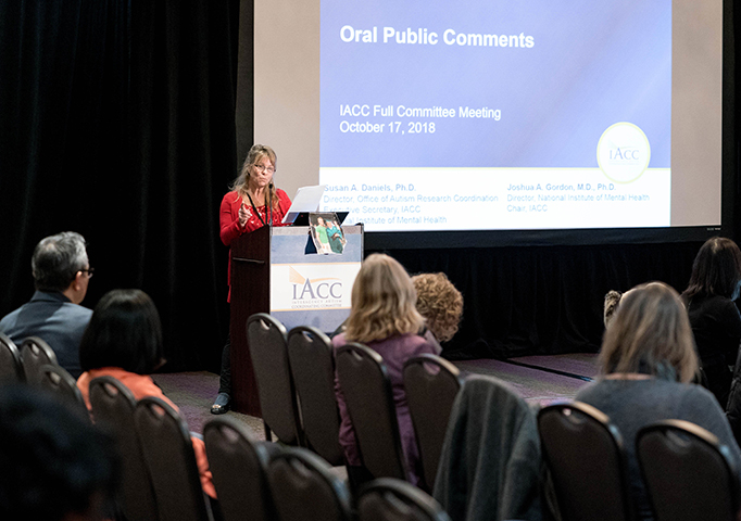 Woman giving oral public comments at January 2019 IACC Meeting